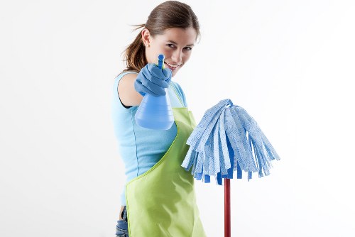 Professional carpet cleaners preparing a transparent quote in a Westcombe Park home