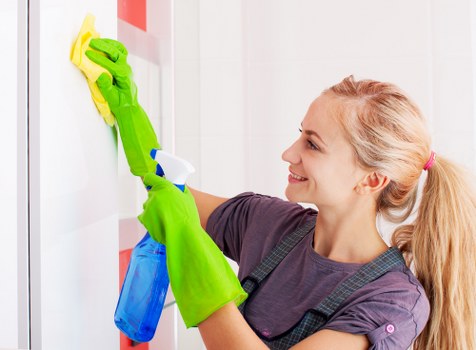 Professional carpet cleaners working on a Westcombe Park home carpet