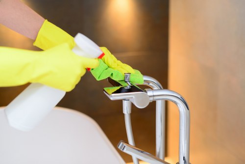 Carpet cleaning team preparing equipment with safety measures in place