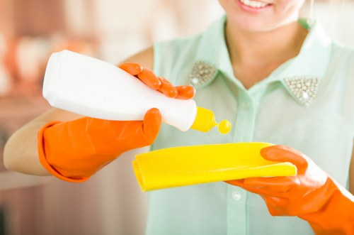 Professional carpet cleaner in Westcombe Park treating a stain
